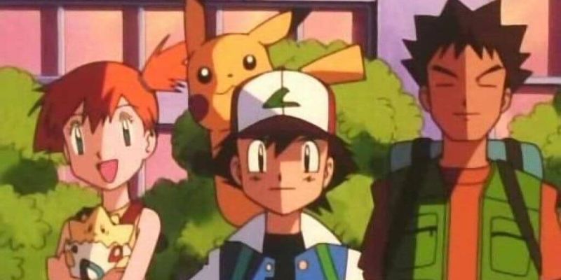 Ash, Misty und Brock stehen Seite an Seite in der Pokémon Indigo League