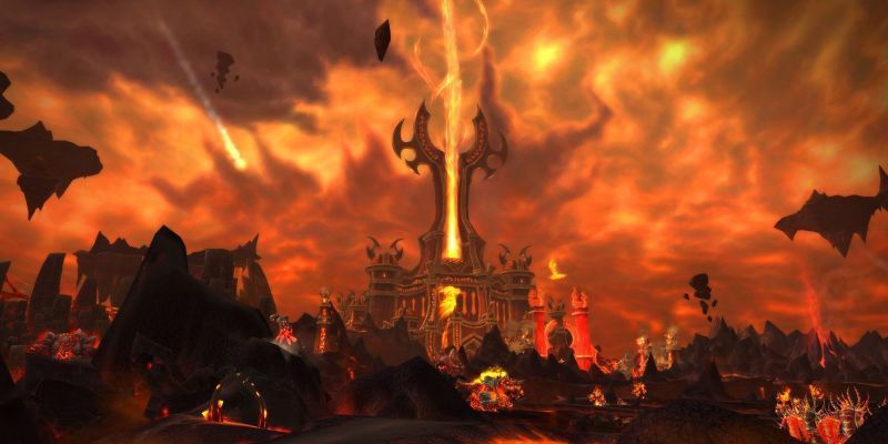 World of Warcraft Cataclysm Firelands con una enorme torre y una columna de llamas