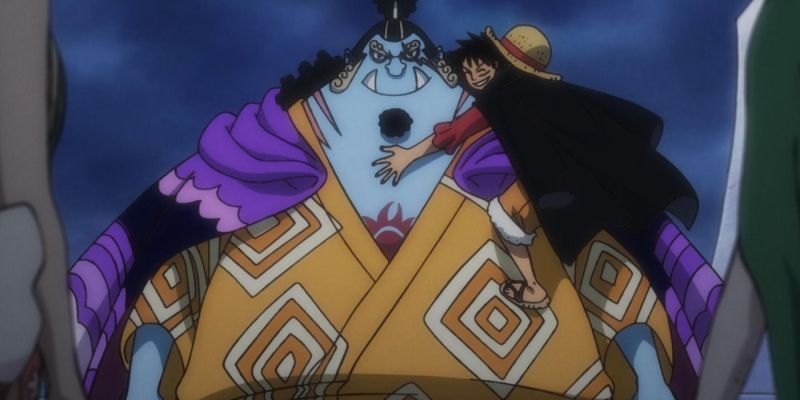 Luffy abrazando a Jinbe en One Piece