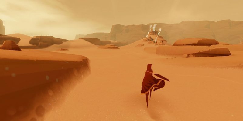 Der Spieler reist in Journey durch die Wüste.