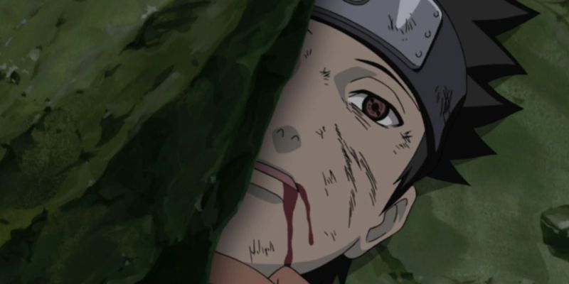 Obito aplastado bajo una roca en Naruto.
